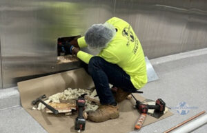 Plumber wearing Atlas Plumbing of Hollywood uniform inspecting early plumbing warning signs