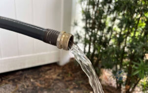 Plumber evaluating low water pressure in a residential plumbing system