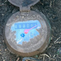 an old water meter being reviewed for possible issues or increased water usage