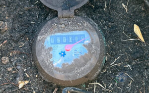 an old water meter being reviewed for possible issues or increased water usage